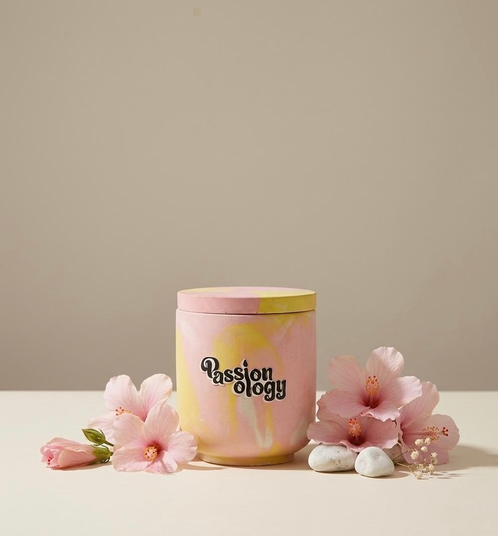 HIBI candle with lid surrounded by hibiscus flowers
